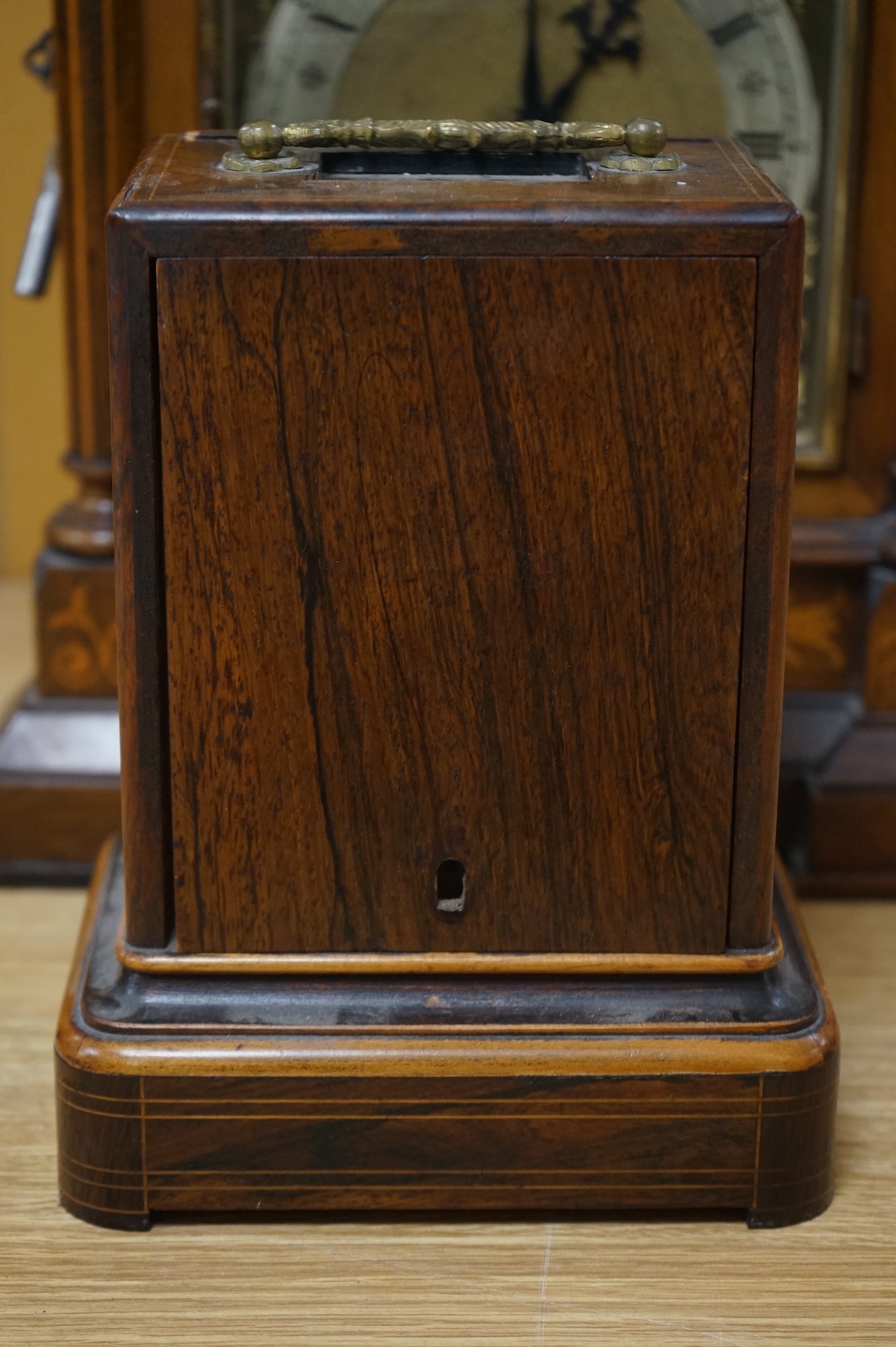 A rosewood mantel clock with French silk suspension movement, together with an Edwardian marquetry bracket clock signed to the dial S.Smith and son, Strand, London with a two train German movement striking on two coiled